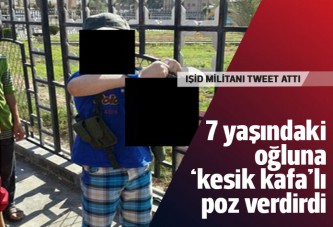 IŞİD militanı 7 yaşındaki oğlunun eline kesik kafa verdi