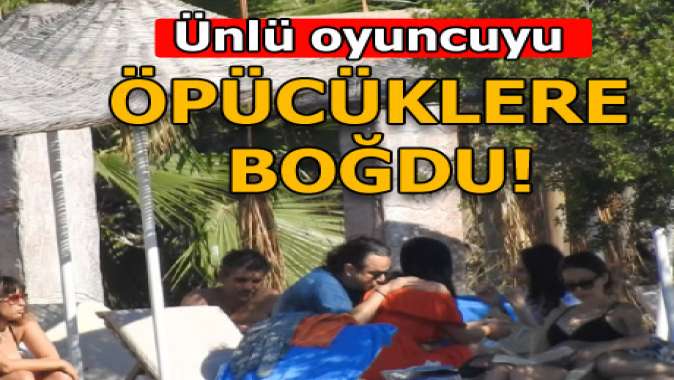 Öpücüklere boğdu