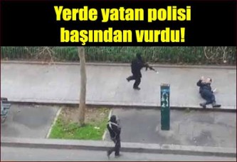 Yerde yatan polisi başından böyle vurdular